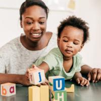 mother and child play with blocks 