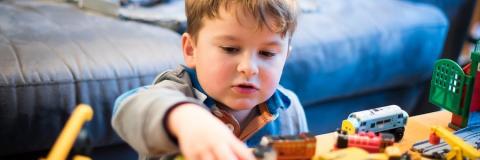 Boy Playing With Toys