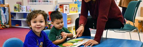 Two boys learning in a Family Support Center. 