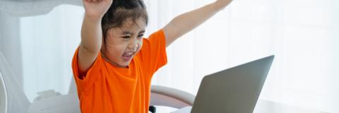 Little girl working at a computer. 