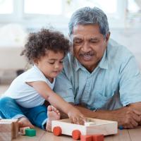 Grandfather and grandson playing. 