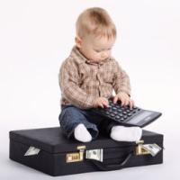 Baby bookkeeper with suitcase of money 