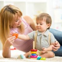 cute mother and child boy play together indoors at home 