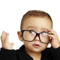 Focus on the youth - baby with glasses 
