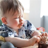 boy eating a birthday cake 