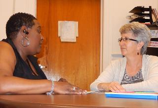 Coaching and Mentoring Child care provider consults with her mentor