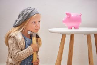 Girl ready to break piggy bank