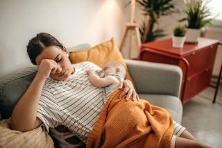 Tired mom with baby. 