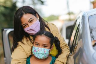 Masked mom and young girl. 