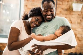 Parents celebrate the birth of a new baby.