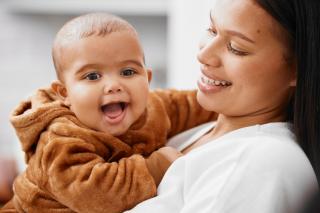 Happy Latino baby and mom. 