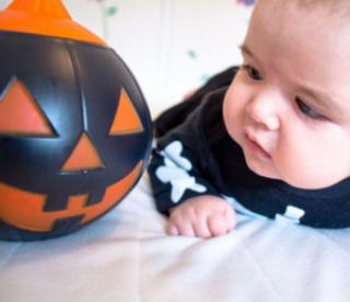 baby under four months old dressed for halloween 