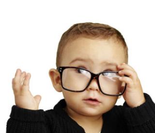 Focus on the youth - baby with glasses 