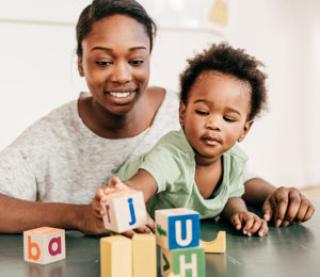 mother and child play with blocks 